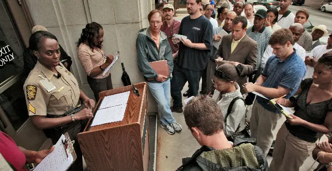 Bidders gathered for a public sale on courthouse steps